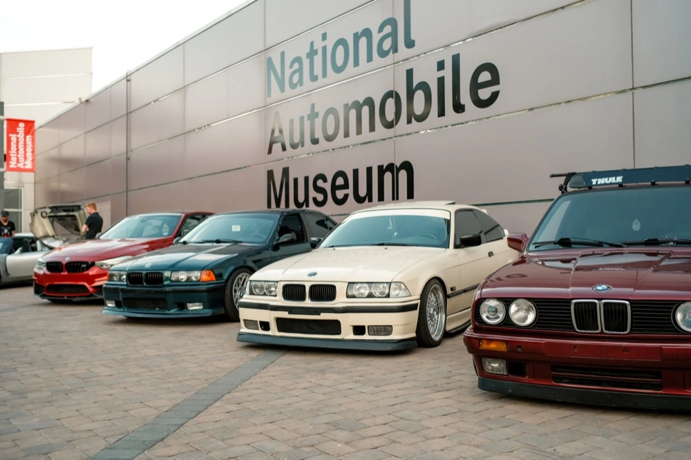 4 BMW cars lined up in front of the National Automobile Museum